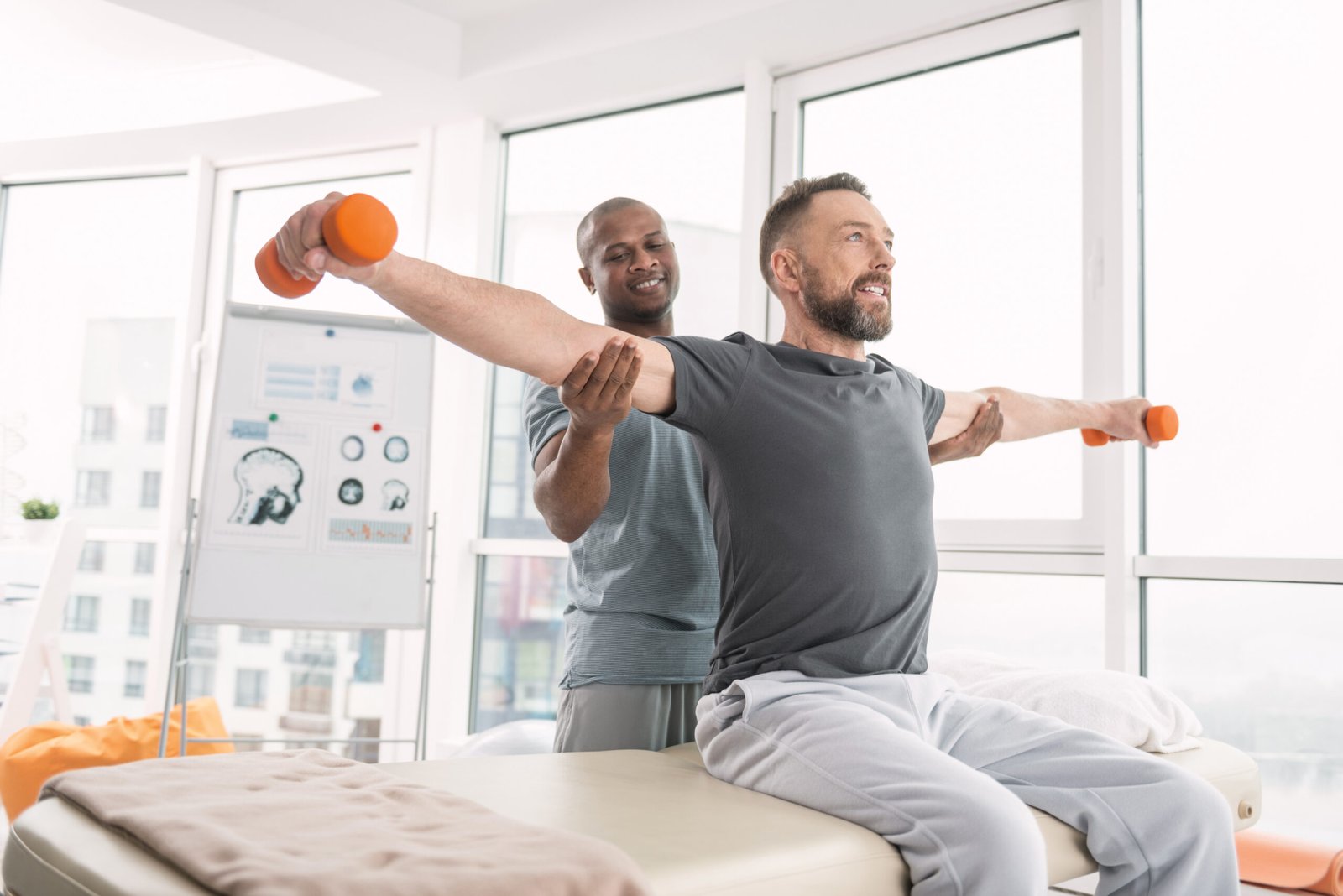 Man training with a personal trainer, focused on strength and hormone balance