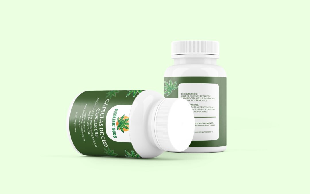 White CBD tablets in a glass jar with hemp leaves in the background.